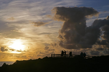 ppl silhouettes n sunset w clouds