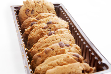 Plastic box filled with cookies isolated