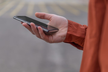 Young adult using his mobile phone