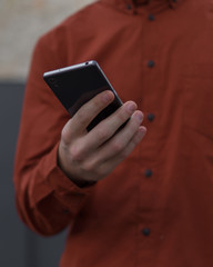 Young adult using his mobile phone