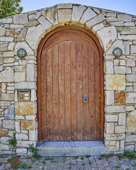 Fototapeta na wymiar Greece, vintage wooden exterior doorway