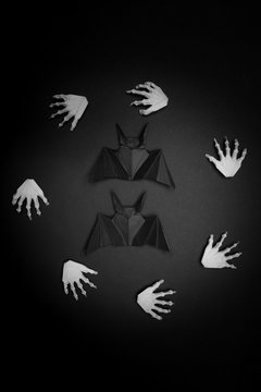 Halloween black background. White hands in a circle.
