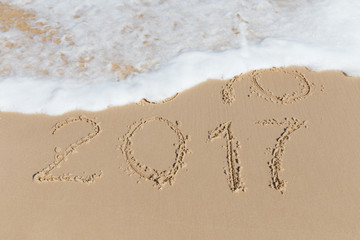 New 2017 Year sign on a sea coast sand