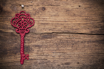 Vintage key on wood background