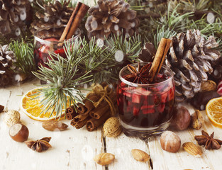 New Year or Christmas composition with walnuts, mulled wine, hazelnuts