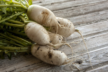 Chinese radishes on wood.