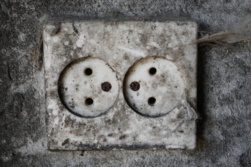 Closeup of old dirty double electrical outlet