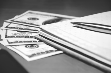 Money, notepad and pen