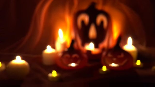 Spooky Halloween Jack-o-Lanterns glowing on a bright orange background with mysterious defocus distortion