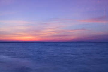 Fototapeta na wymiar Stunning sunset on the empty beach, Cape Cod, USA