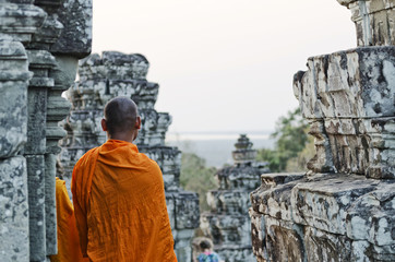 buddhist monk at angkor wat temple near siem reap cambodia - obrazy, fototapety, plakaty