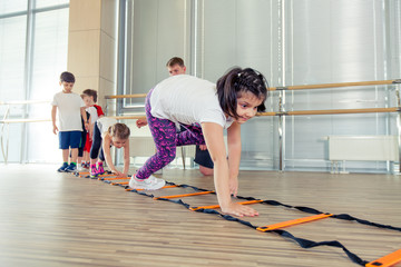 Obraz premium Happy sporty children in gym.