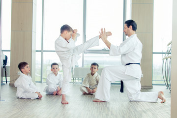 Fototapeta na wymiar young, beautiful, successful multi ethical kids in karate positi