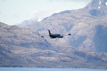 Fototapeta na wymiar Military Plane in Chilean Fijords