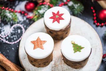 Traditional Christmas fruit rich cakes with decoration