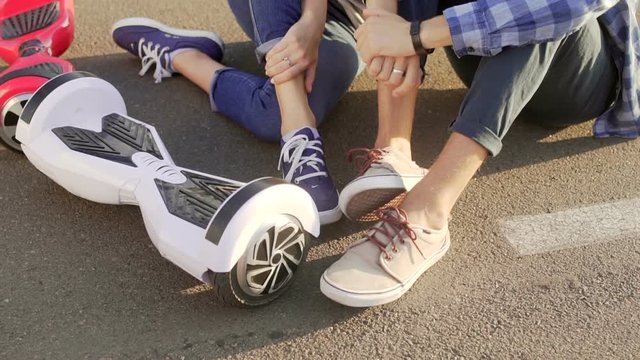 Close up shot of couple with hoverboards