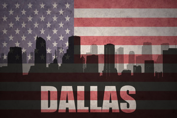 abstract silhouette of the city with text Dallas at the vintage american flag