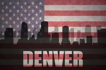 abstract silhouette of the city with text Denver at the vintage american flag