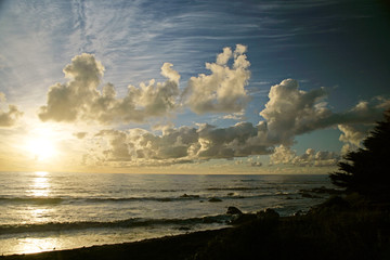 beach ocean sunset clouds