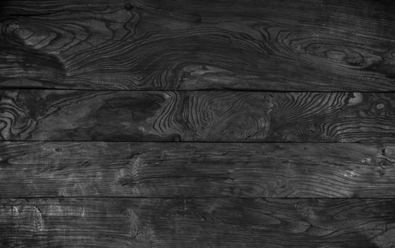 Black wood background, charred planks, painted black stain boards