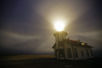lighthouse in nite fog