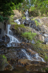 Fototapeta na wymiar Low water flow at the lower fall of the Silvermine Waterfalls on the Lantau Island in Hong Kong, China.