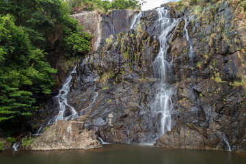 Low water flow at the main fall of the Silvermine Waterfalls on the Lantau Island in Hong Kong, China.