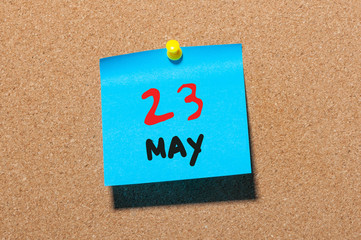 May 23rd. Day 23 of month, calendar on cork notice board, business background. Spring time, empty...