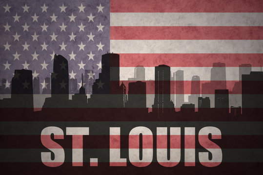 abstract silhouette of the city with text St. Louis at the vintage american flag