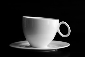 Cup of coffee on black background