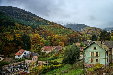 Fototapeta na wymiar Little village in mountains autumnal view, Murbach