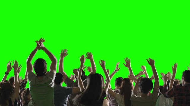 Crowd of fans dancing on green screen. Concert, jumping, Dancing.  Slow motion.  Shot on RED EPIC Cinema Camera.