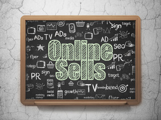 Marketing concept: Online Sells on School board background