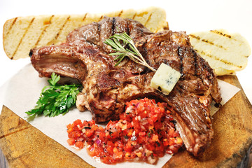 fried steak on a wooden board