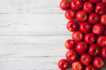 Wooden background with red apples - Powered by Adobe