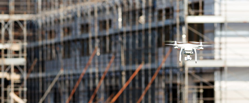 Quadcopter drone flying in a construction site