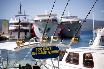Selbstklebende Fototapeten Big game fishing boat and equipment for rent © asafaric