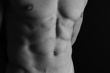 Fototapeta na wymiar Strong Athletic Man muscular body, torso, hair removal, and six pack abs close up, copy space