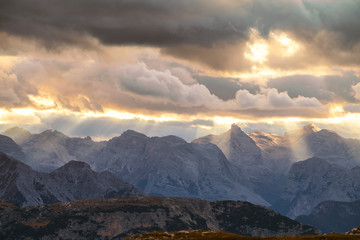 Naklejka na ściany i meble Mountains Panorama of the Dolomites at Sunrise with clouds
