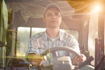 Farmer driving a tractor in his field