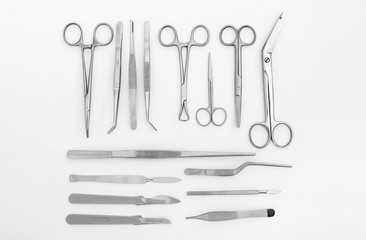 Flat lay of medical instruments on white background