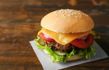 Big tasty hamburger on napkin