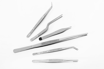 Flat lay of medical instruments on white background