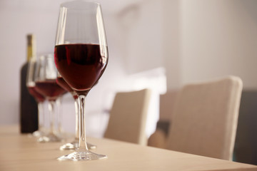Glasses of red wine on table in restaurant