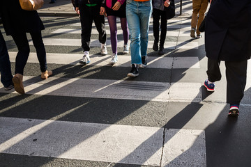 crowd of people crossing a street
