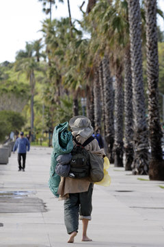 Barefoot Hiker On Sidewalk