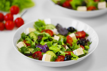 Fresh delicious salad on white background, closeup