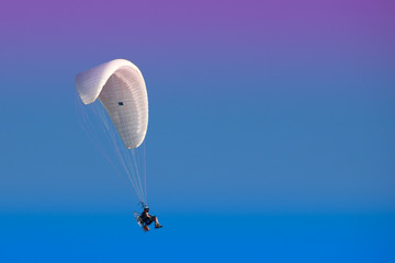Paramotor in a blue sky