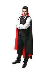 Young man dressed in vampire costume for Halloween, isolated on white