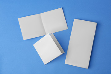 Blank booklets on blue background
